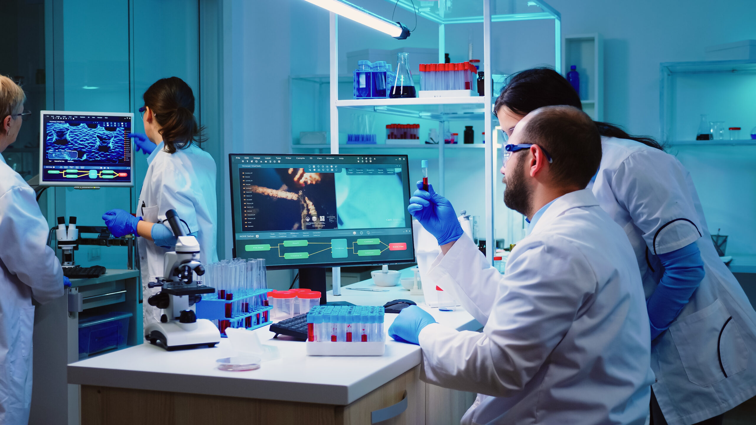 Laboratory professional working with sample tubes and diagnostic equipment